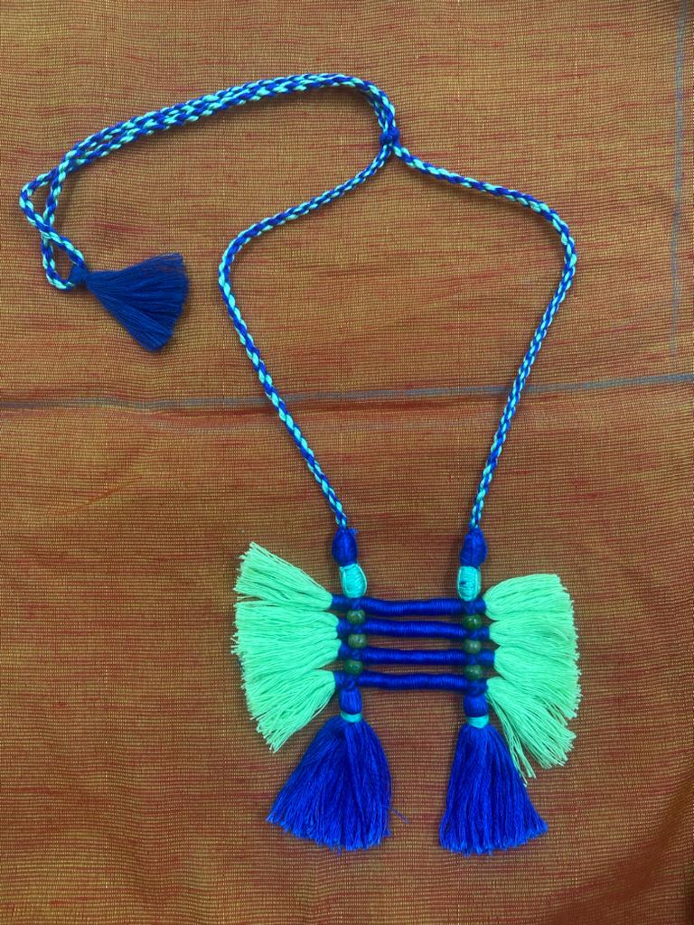 Blue and green tasseled neck piece