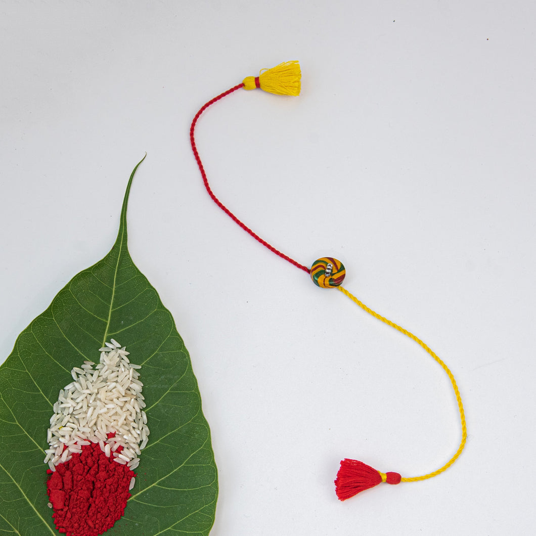 Lac Button Red & Yellow Twisted Yarn Rakhi